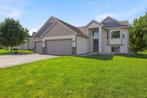Three-car garage offers abundant space for vehicles, storage, and equipment