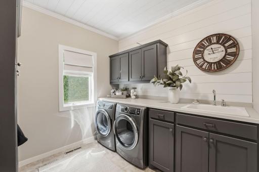 Main-level finished laundry room offers practical convenience for busy households.