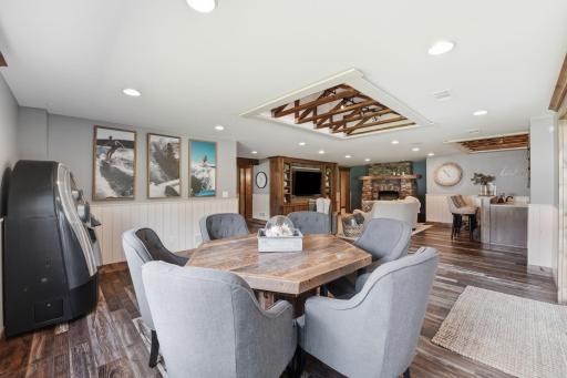Lower level gathering space includes seating area that will raise the bar on your next game night.