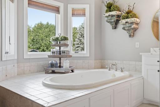 Tiles surrounding the bath adds to the spa like atmosphere.