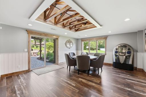 Beautiful photography captures every detail of the home's craftsmanship and design. Space is suitable for this sitting area, but could also accommodate billiards.