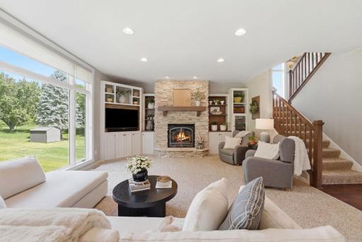 A warm and inviting space designed for everyday living, open stairwell lends more natural light.