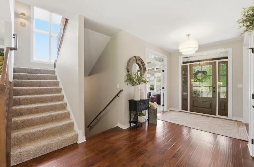 Central foyer enhances connectivity between the home's main gathering areas.