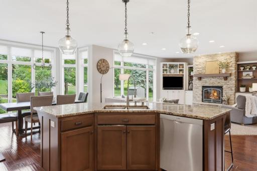 Kitchen merges with informal dining space perfectly. The window scape continues to impress.