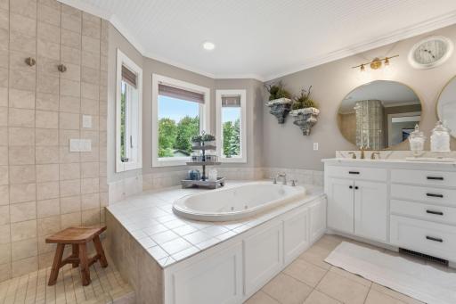 Luxurious spa-like soaking tub creates the perfect place to relax and unwind, merges with the walk in shower.