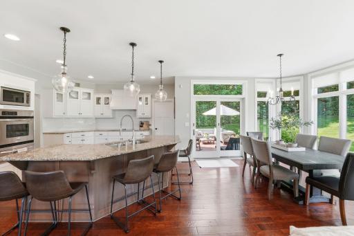 Back deck access serves to allow great view from kitchen and informal dining.