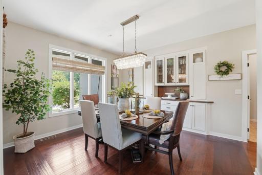 Front-facing windows fill the dining room with abundant natural light, enjoy the built in buffet for your more formal dining events.