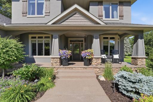 Covered front porch enhances the home's curb appeal and outdoor living.