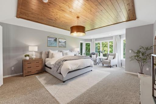An inviting primary bedroom that combines generous proportions with a tranquil atmosphere.