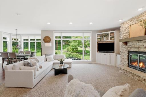 Expansive windows invite sunlight to pour into the living room. This is a need to see in person how striking the view is when you enter the home.