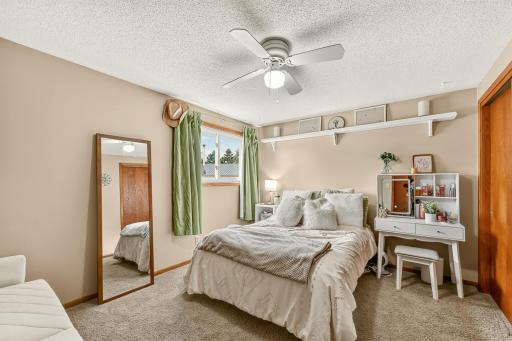 Bedroom 3 on main floor with ceiling fan