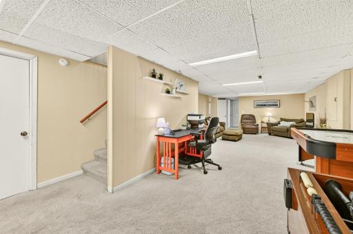 Very large lower level family room and flex space. Large storage space with laundry room at base of stairs.