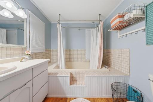 Spacious soaking tub provides a peaceful escape for rest and rejuvenation.