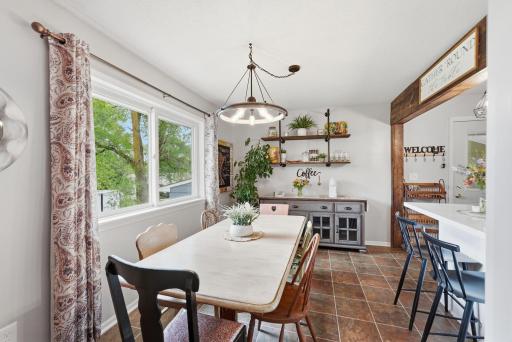Dining area is enhanced by a beautiful window that creates a bright and welcoming atmosphere.