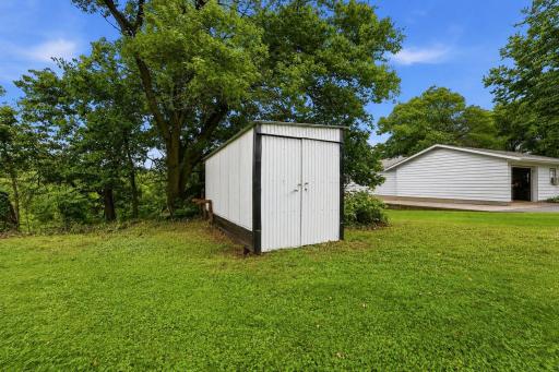 Property features a utility shed for all your outdoor tools.