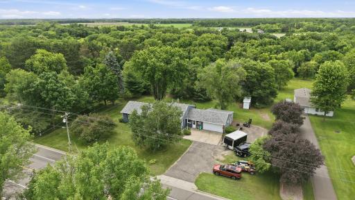 Drone imagery provides a comprehensive view of the home, yard, and surrounding area.