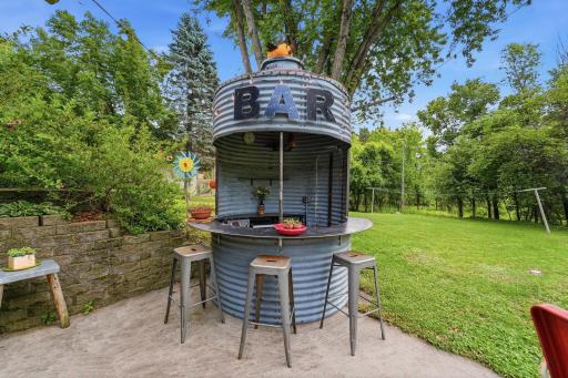 Outdoor beverage station provides a convenient place to serve drinks and socialize.