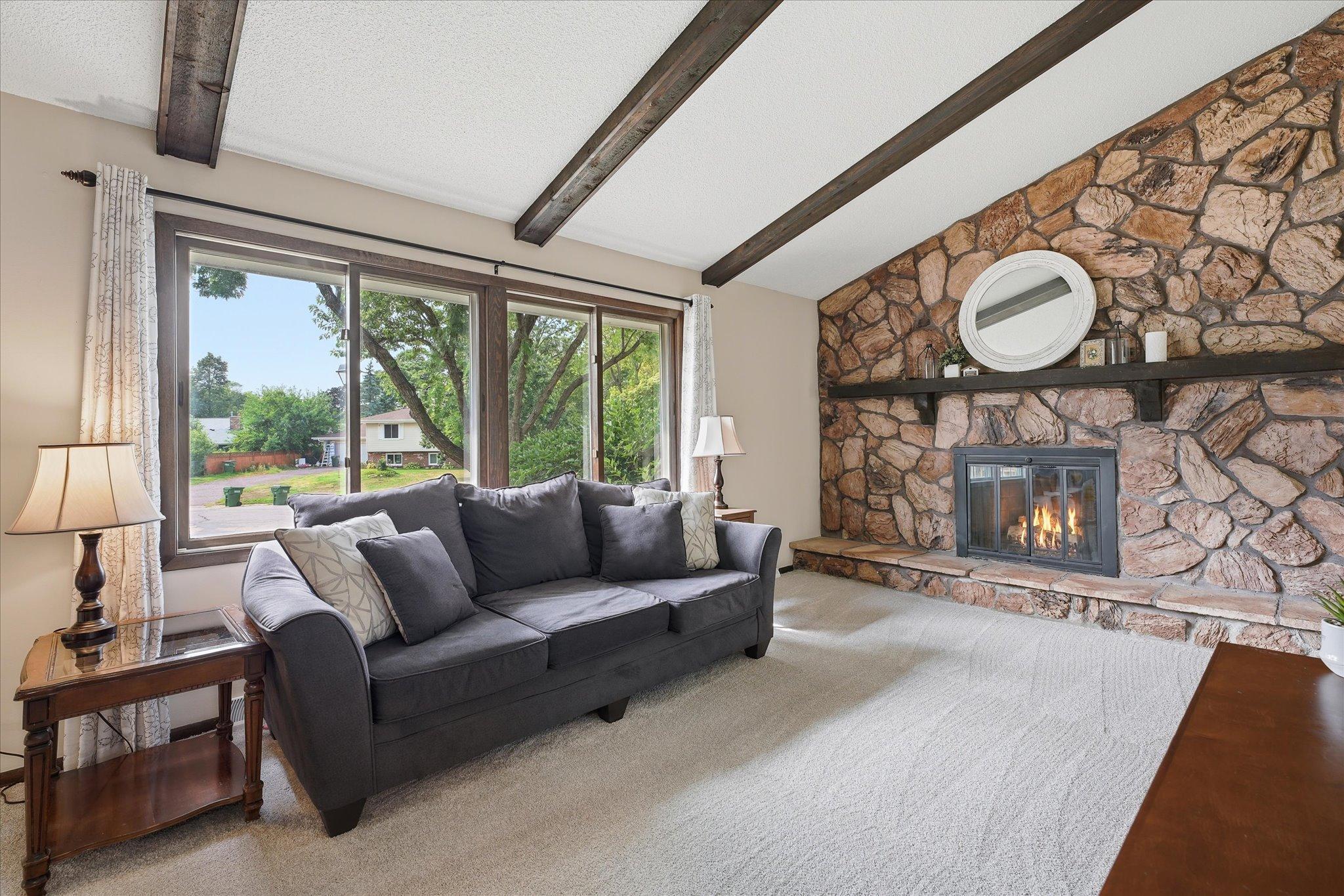 Living room with wood burning fireplace