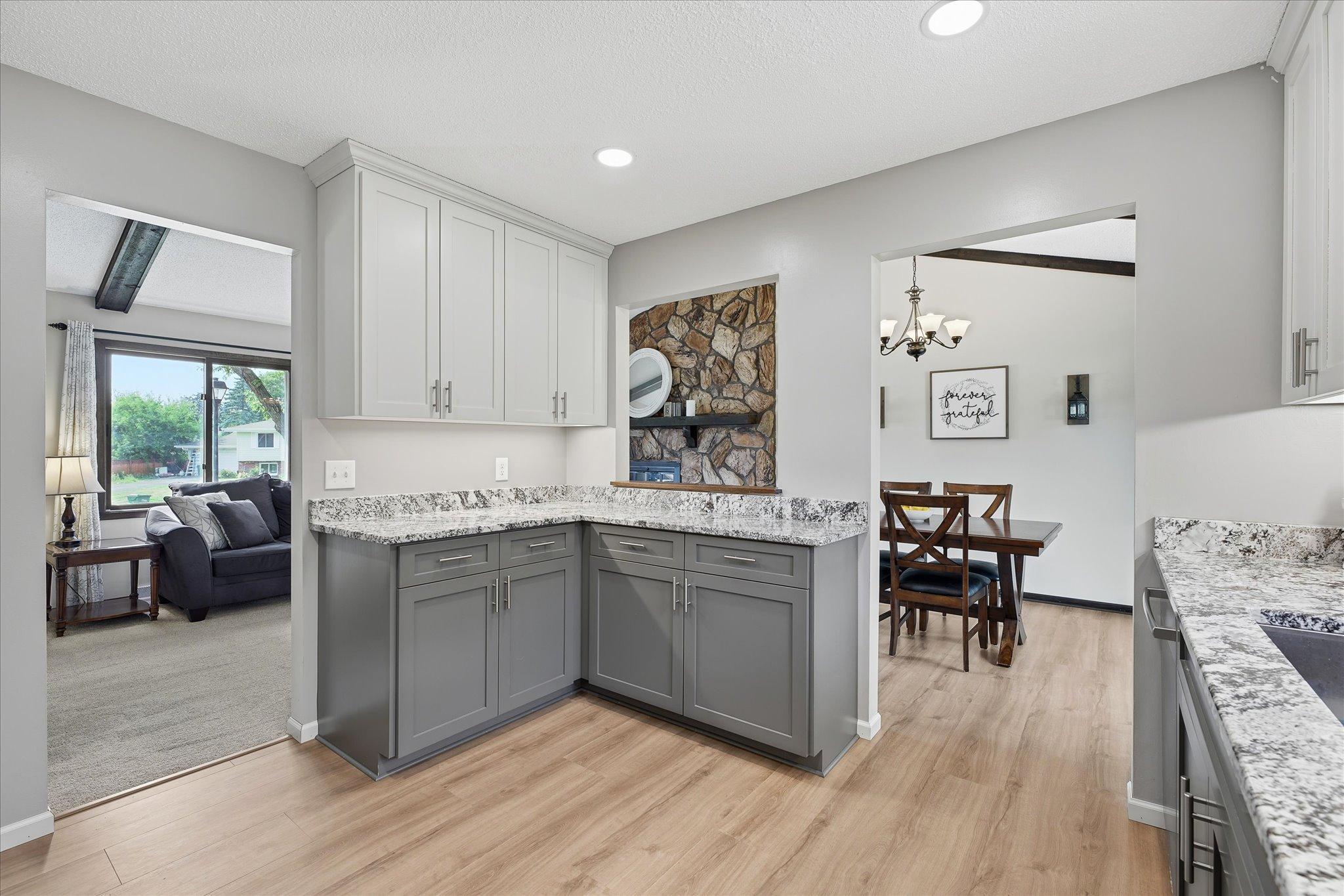 Fully updated kitchen with stainless steel appliances, granite counters, and custom cabinets
