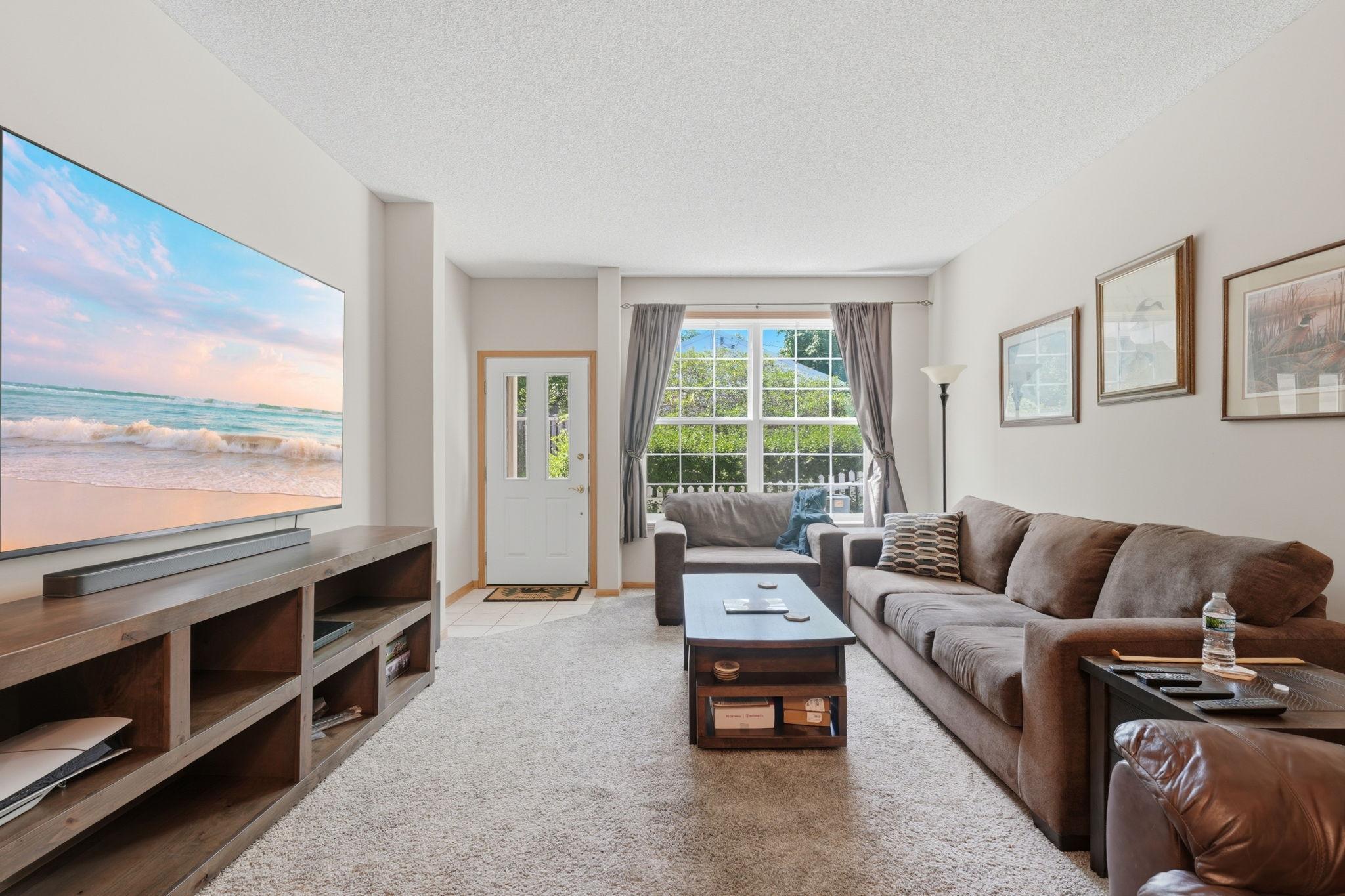 Spacious living with open floor plan to dining and kitchen