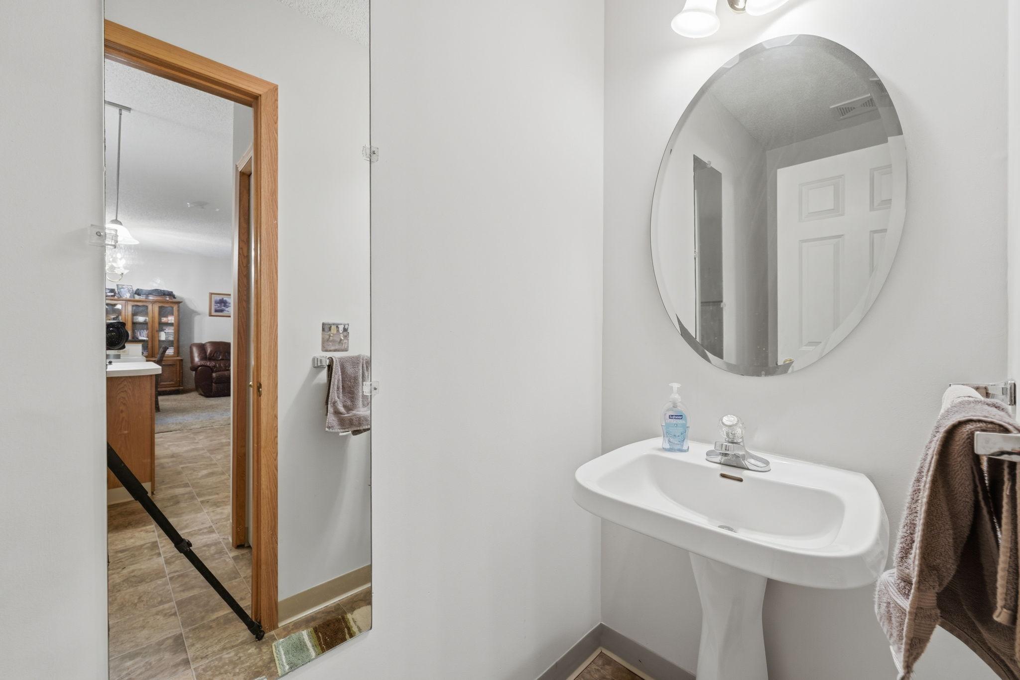 Main floor half bath is conveniently located off kitchen