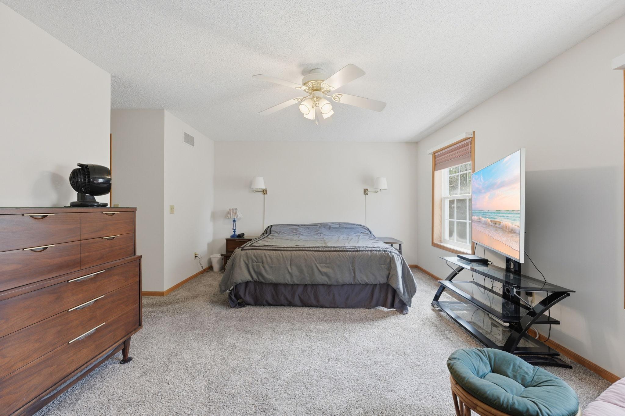 Oversized primary bedroom with walkin closet