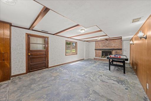 Lower Level Family Room With Wood Burning Fireplace