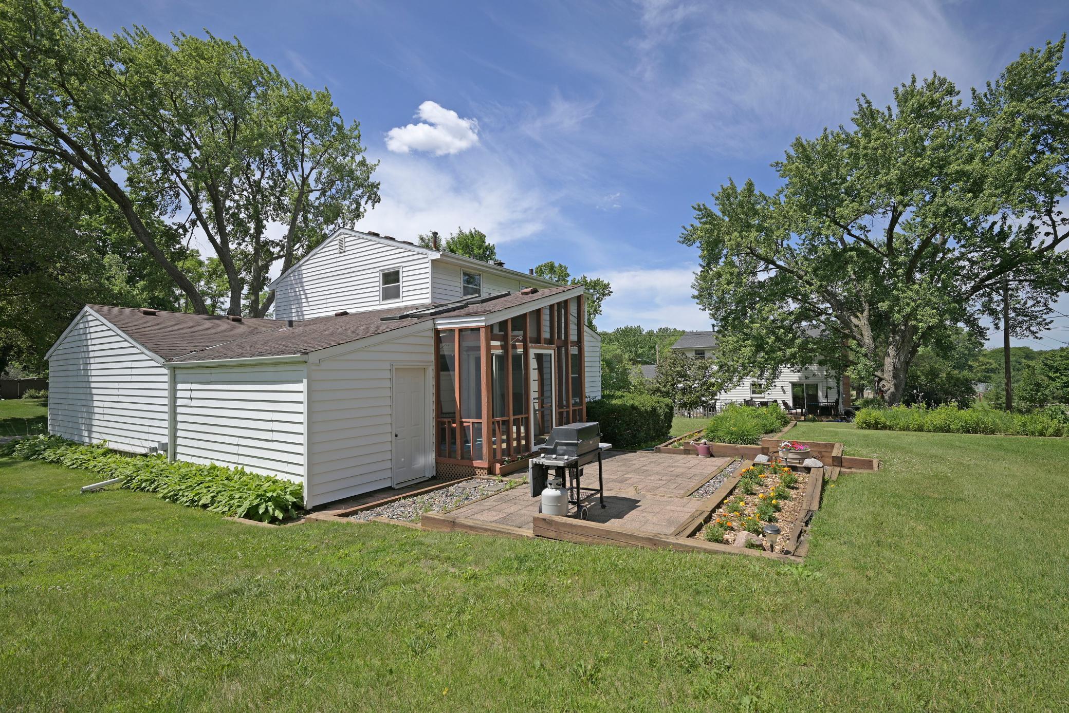 Yard has gardens and flat for play area