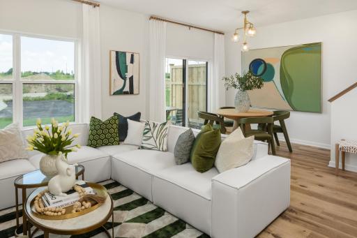 Soak up the sunshine in this comfortable living area, just steps from the dining space. *Photo of a previously built home of the same floor plan. Finishes/options may vary.