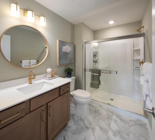 Refresh and recharge in this primary bathroom, featuring a generous vanity and a walk-in shower. *Photo of a previously built home of the same floor plan. Finishes/options may vary.