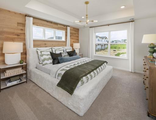 Wake up refreshed in this relaxing primary bedroom, featuring generous windows and plenty of room to unwind. *Photo of a previously built home of the same floor plan. Finishes/options may vary.