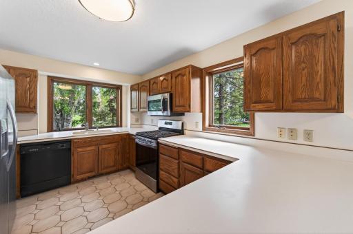 Efficiently designed kitchen with ample counters and gas range and room for endless possibilities.