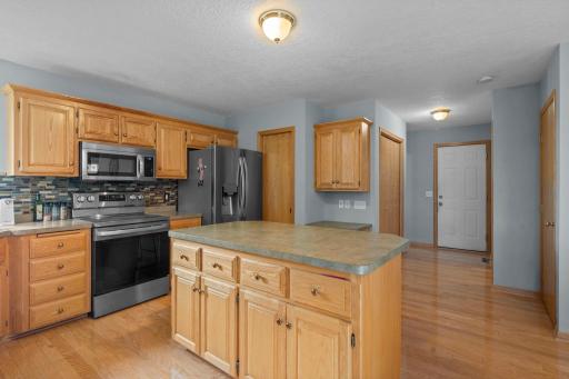 Kitchen has a plenty of cabinet and counter space and a pantry
