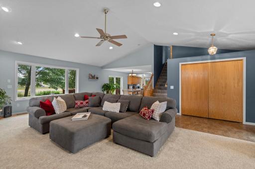 Living room flows into the dining room and kitchen offering open concept living great for hosting and entertaining