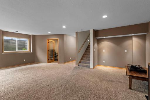 Enjoy the expansive lower-level family room, perfect for movie nights, hobbies, a play area, or additional living space