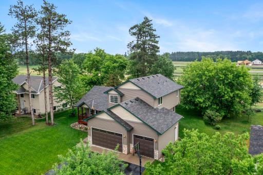 Enjoy the large flat yard with mature tree coverage for added privacy