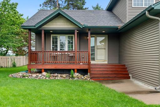 Welcoming front entry features a charming covered front porch
