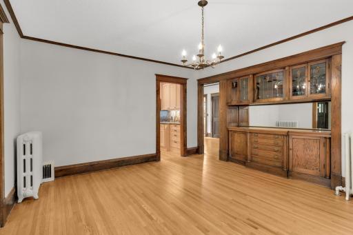 Note the beautiful glass front built-ins - door on the left leads to the kitchen - door to the right leads to the bedroom and full bath