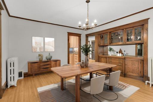Virtually staged formal dining room in main level unit