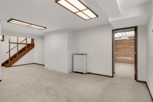 Stairs on the left lead to the main level unit and door on the right shows walk through closet