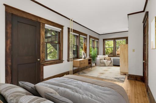 Virtually staged main floor bedroom - large enough to accomodated an additional sitting area