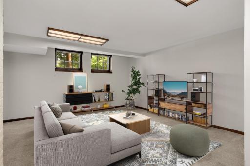 Lower level bedroom (virtually staged as a family room) as part of the main floor unit