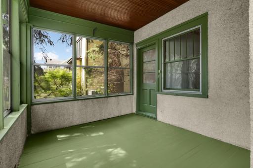 Front door off front screened porch leading to 2nd floor unit