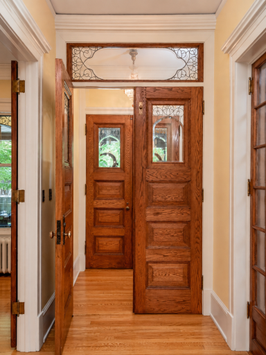 Enter through the double doors with Art Nouveau leaded glass windows and transom