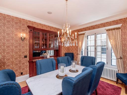 The sparkling crystal chandelier, elegant wall sconces and buffet lighting help set the mood