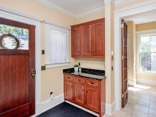 Off the kitchen you will find the back entryway of the home
