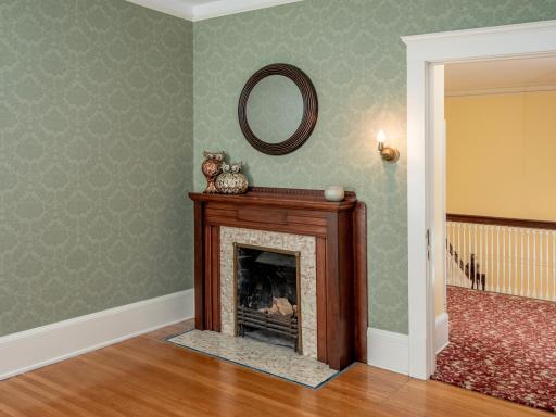 The wood-burning fireplace serves as a beautiful focal point