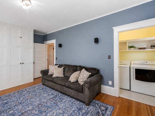 The second-level laundry is housed in this closet
