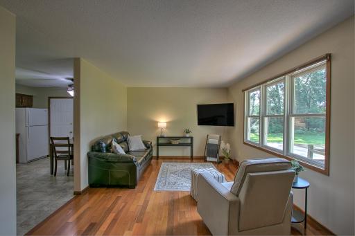 Beautiful Brazilian hardwood floors flow from the living room and towards the bedrooms and hallway. Convenient eat in kitchen right by the living room.