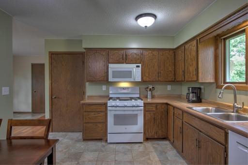 Cozy kitchen with great counter space for prepping dinners! Love the kitchen window that overlooks the backyard